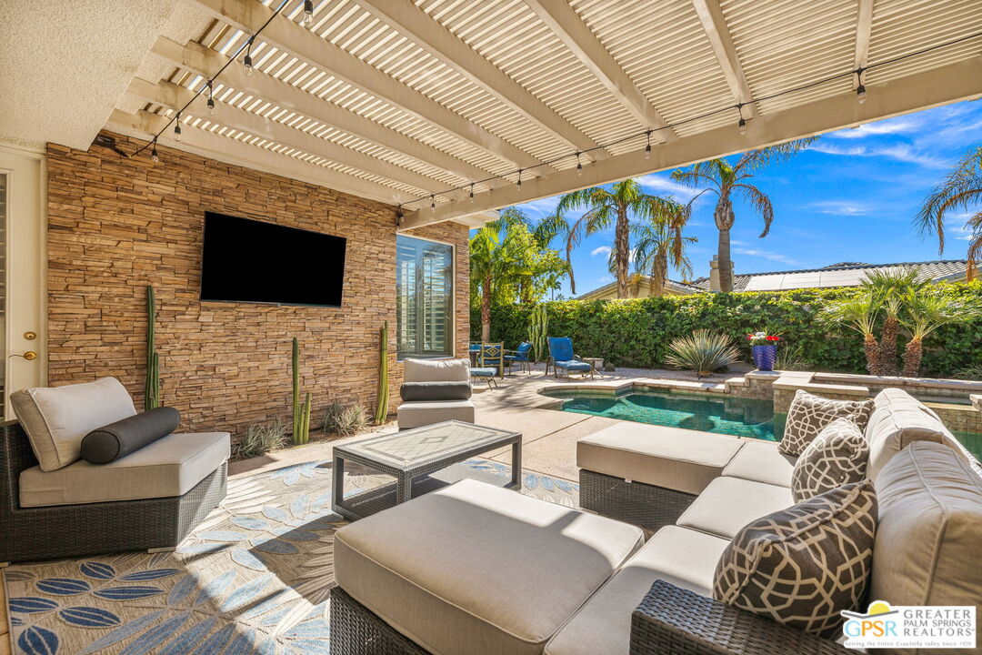 51 Killian Way Rancho Mirage, CA 92270 - Photo 63 of 71 a outdoor living space with patio furniture and a fireplace