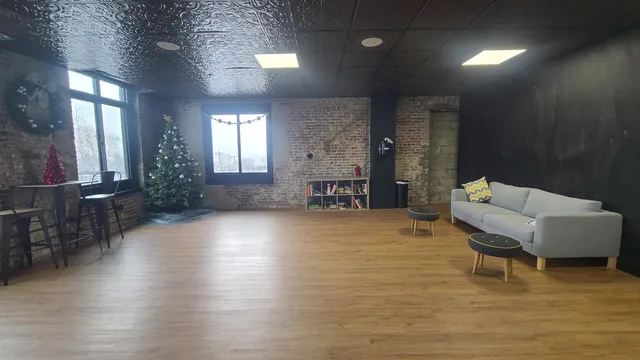 a hallway with a table and chairs