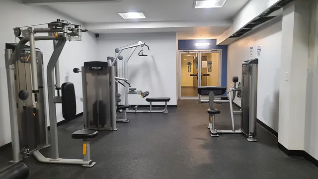 a kitchen with stainless steel appliances granite countertop a sink a counter space and cabinets