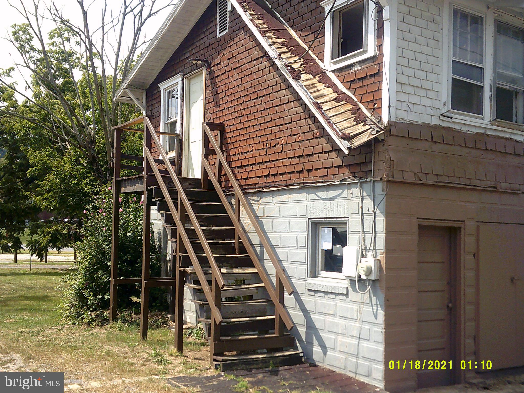 14210 Croghan Pike Mount Union, PA 17066 - Photo 6 of 12 a front view of a house with a garden