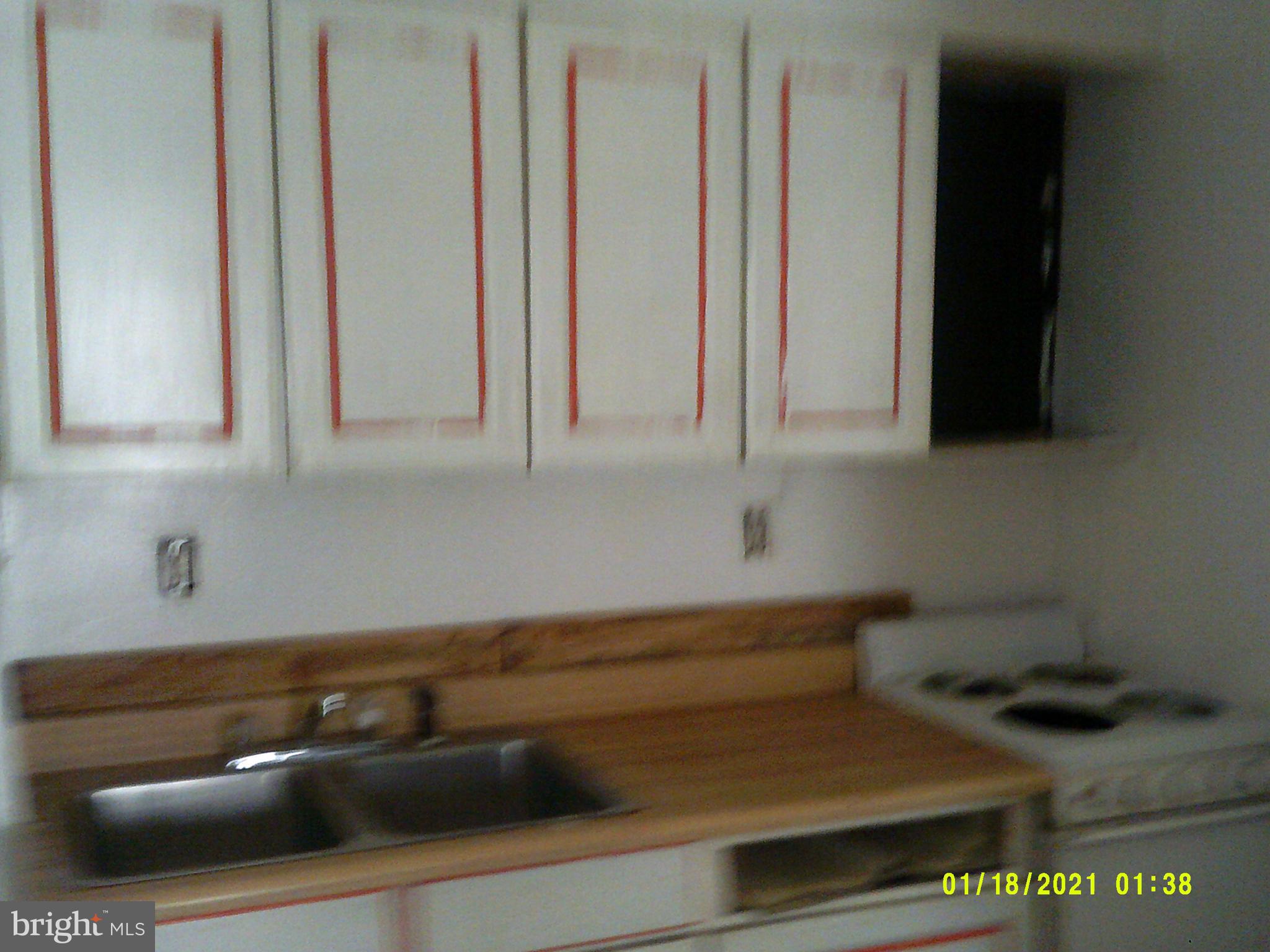 14210 Croghan Pike Mount Union, PA 17066 - Photo 8 of 12 a kitchen with a sink and cabinets