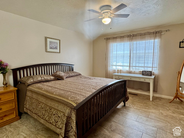 445 Topaz Boulevard, Unit 10 Delta, UT 84624 - Photo 11 of 28 Bedroom with a textured ceiling and a ceiling fan