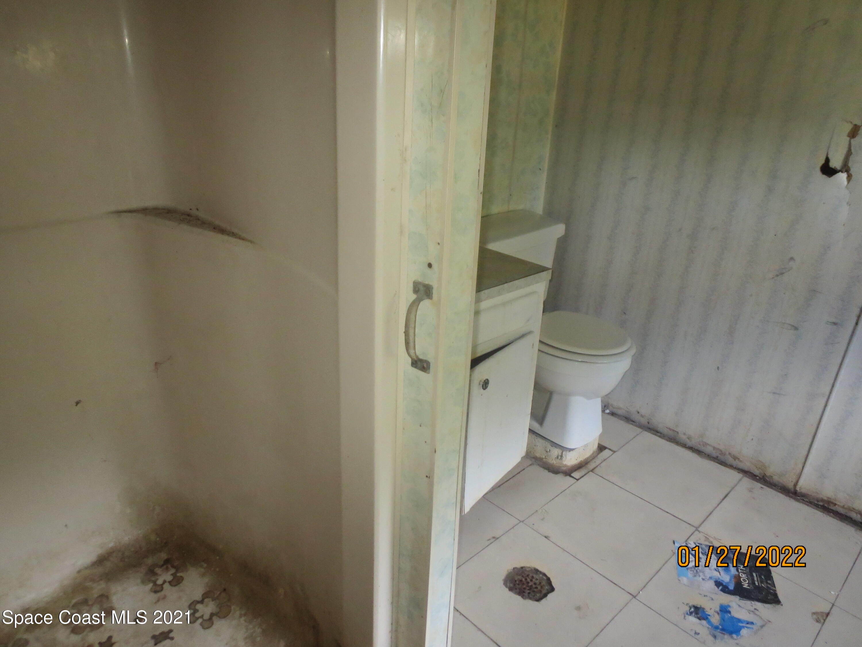 2420 Post Road Melbourne, FL 32935 - Photo 49 of 50 a bathroom with a toilet and a shower