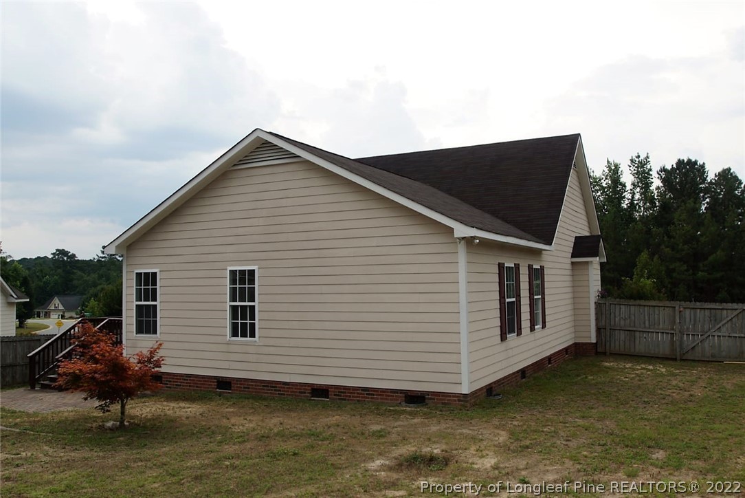 5836 Spreading Branch Road Hope Mills, NC 28348 - Photo 18 of 48 a view of a house with backyard