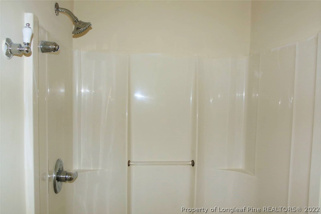 5836 Spreading Branch Road Hope Mills, NC 28348 - Photo 3 of 48 a bathroom with a shower