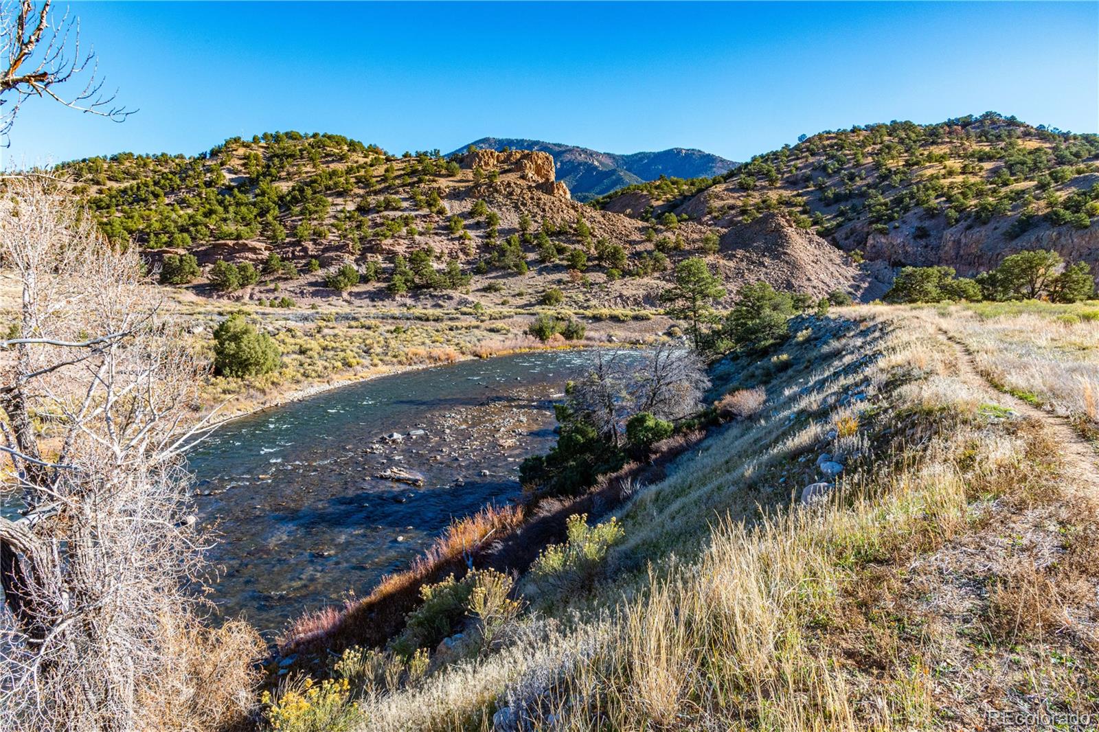 10817 Highway 50 Howard, CO 81233 - Photo 11 of 34 a view of a houses with a lake