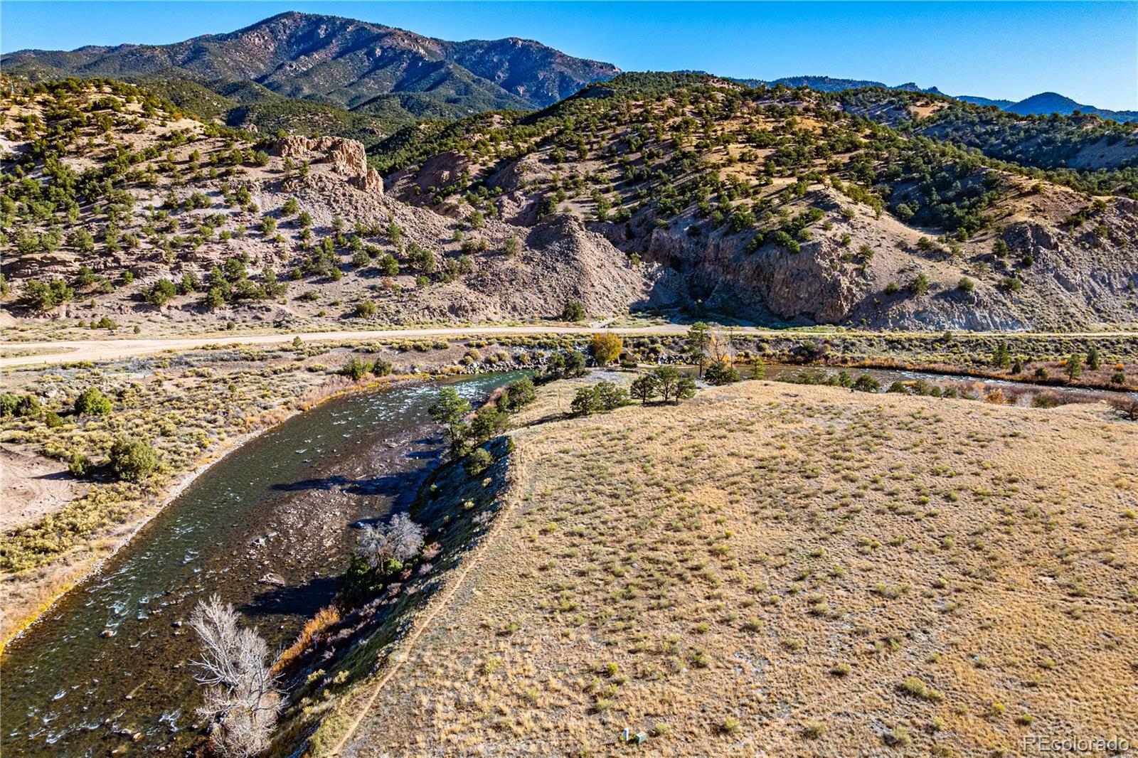10817 Highway 50 Howard, CO 81233 - Photo 6 of 34 a view of a yard with a mountain view in the background