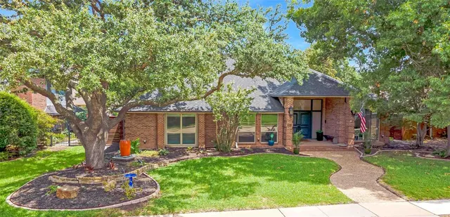 a view of a house with backyard porch and sitting area