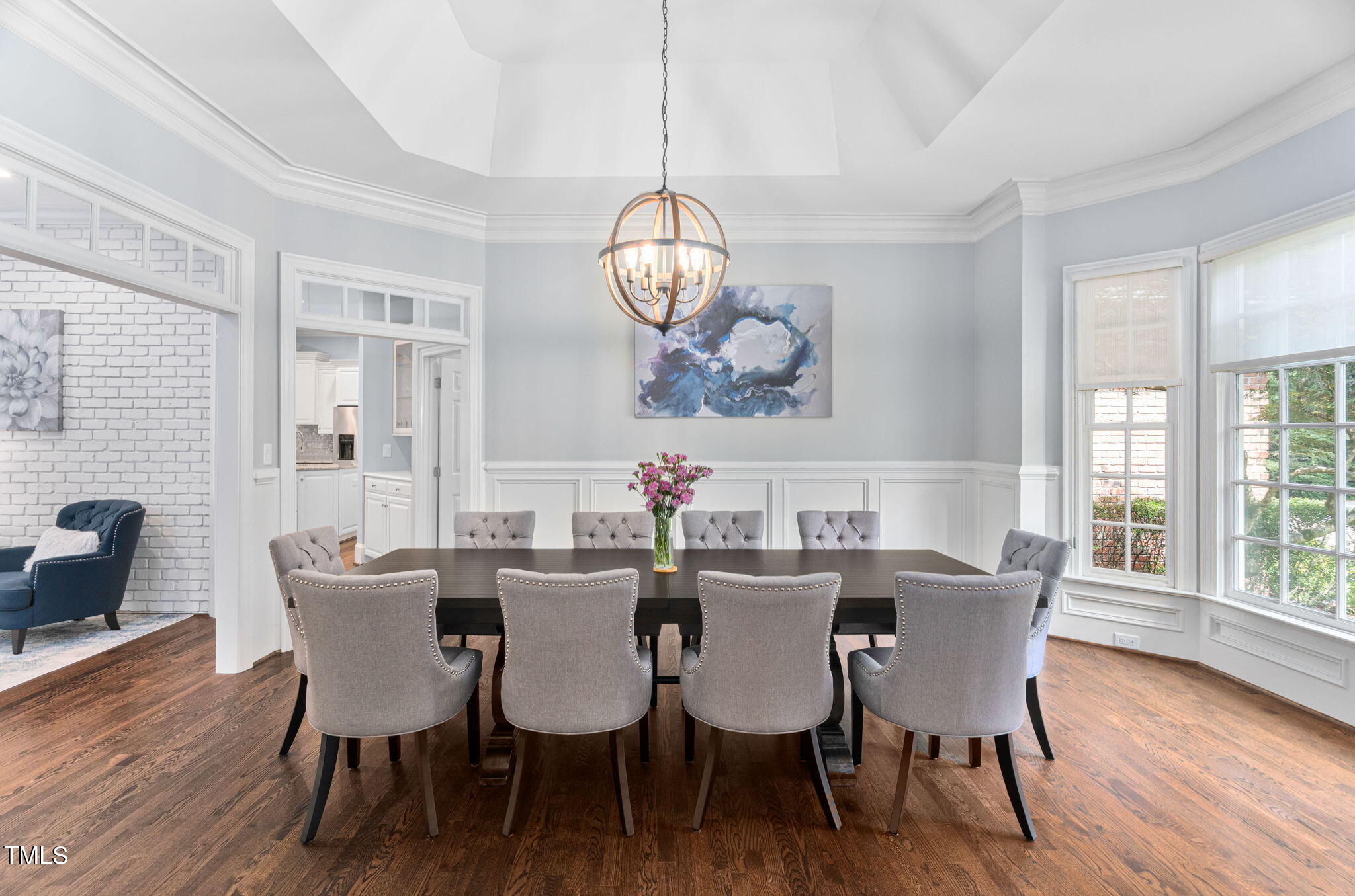114 Kendleton Place Cary, NC 27518 - Photo 13 of 88 a view of a dining room with furniture a chandelier and wooden floor