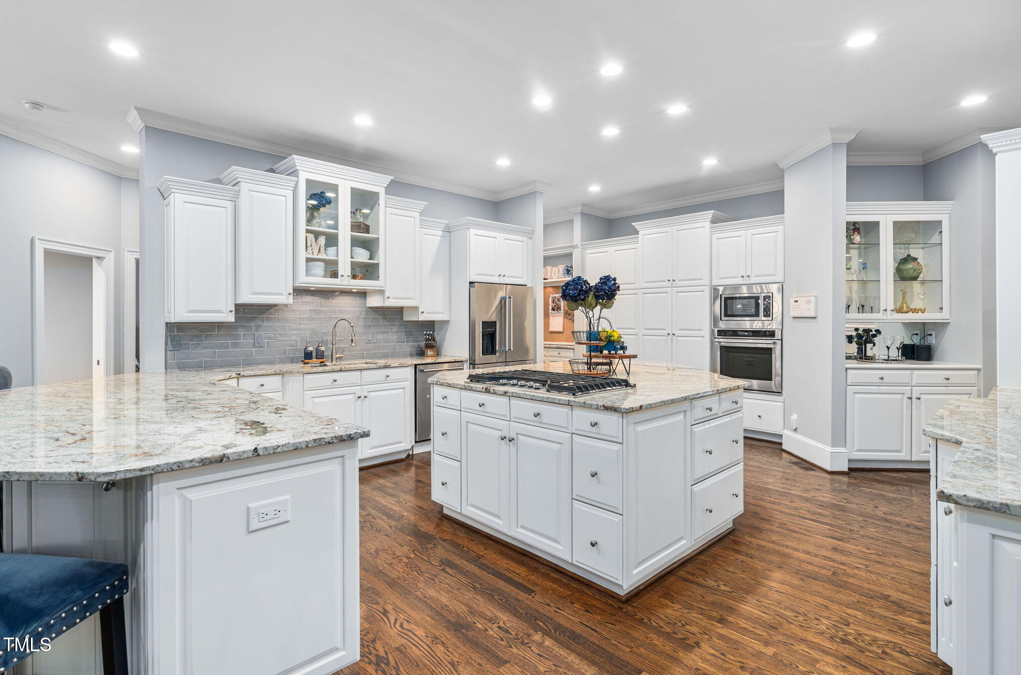 114 Kendleton Place Cary, NC 27518 - Photo 14 of 88 a kitchen with stainless steel appliances granite countertop a stove oven and a refrigerator