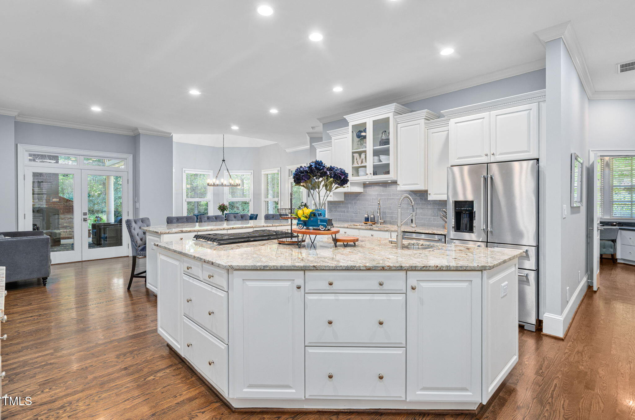114 Kendleton Place Cary, NC 27518 - Photo 15 of 88 a kitchen with white cabinets appliances and wooden floor