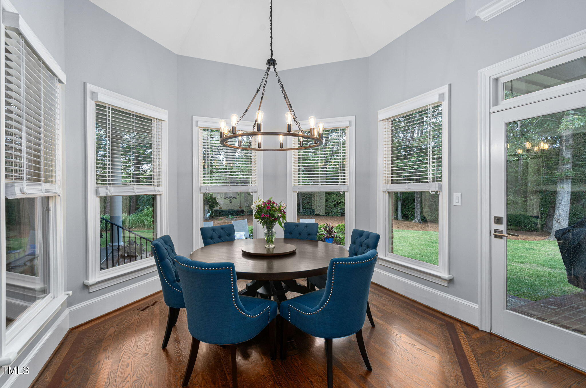 114 Kendleton Place Cary, NC 27518 - Photo 21 of 88 a dining room with furniture wooden floor and a chandelier