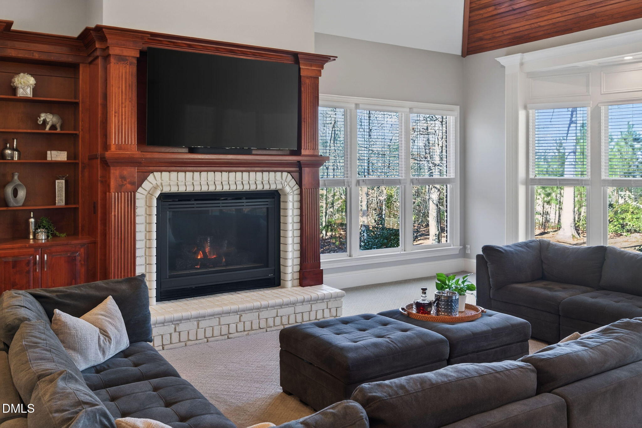 114 Kendleton Place Cary, NC 27518 - Photo 24 of 88 a living room with furniture a flat screen tv and a fireplace