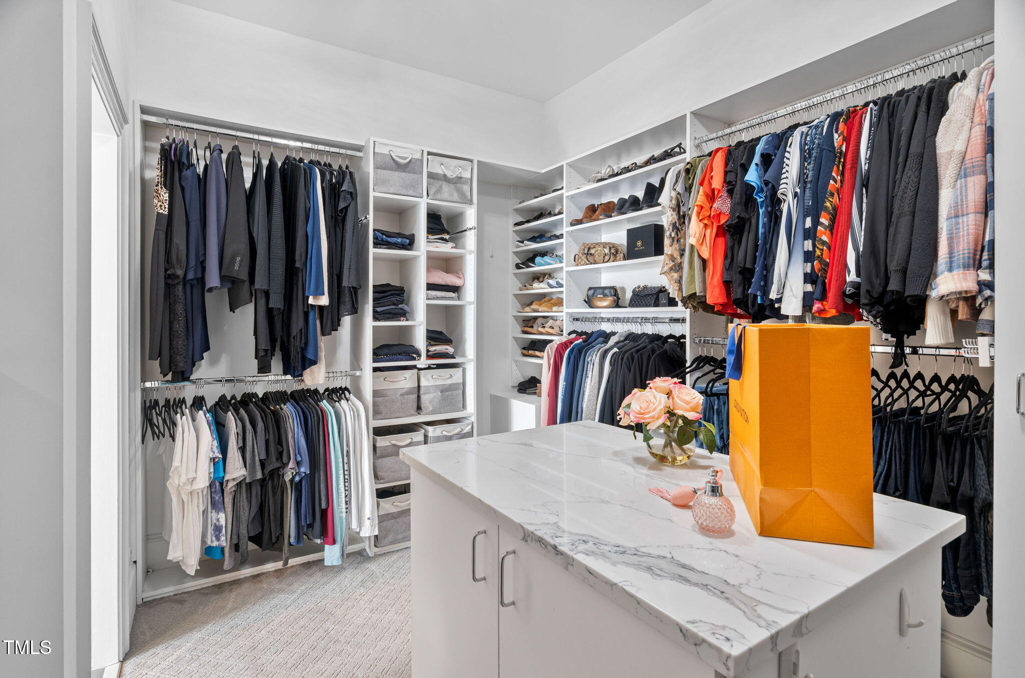 114 Kendleton Place Cary, NC 27518 - Photo 35 of 88 a view of walk in closet with clothes and shoes