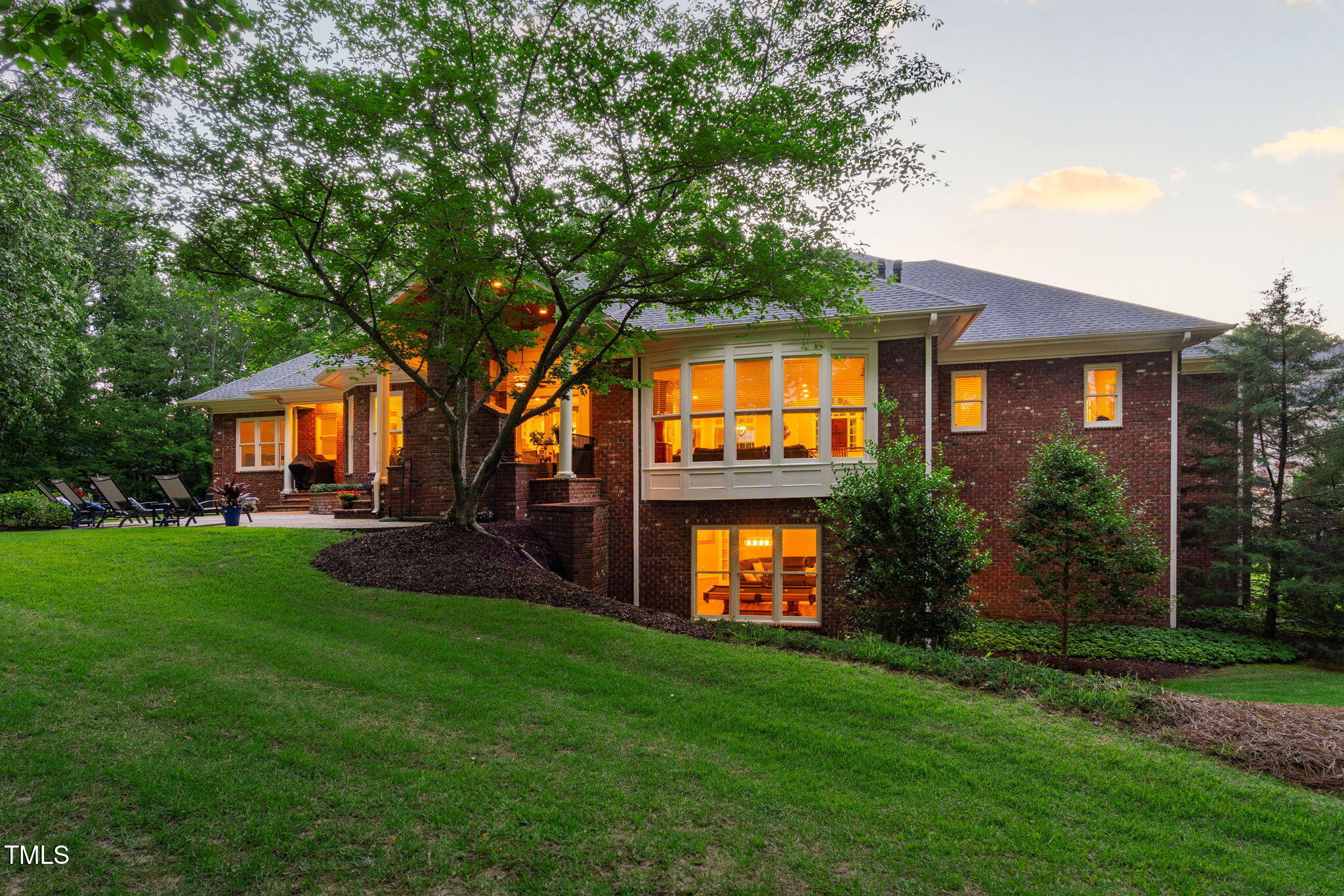 114 Kendleton Place Cary, NC 27518 - Photo 4 of 88 a front view of a house with a garden and yard