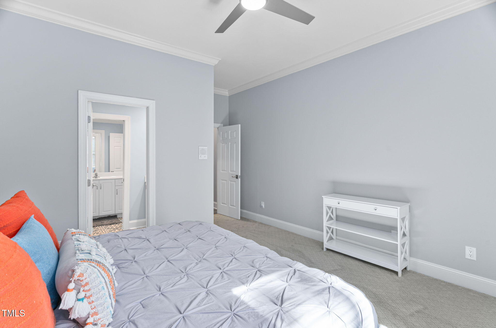 114 Kendleton Place Cary, NC 27518 - Photo 45 of 88 a bedroom with a bed and a chandelier fan