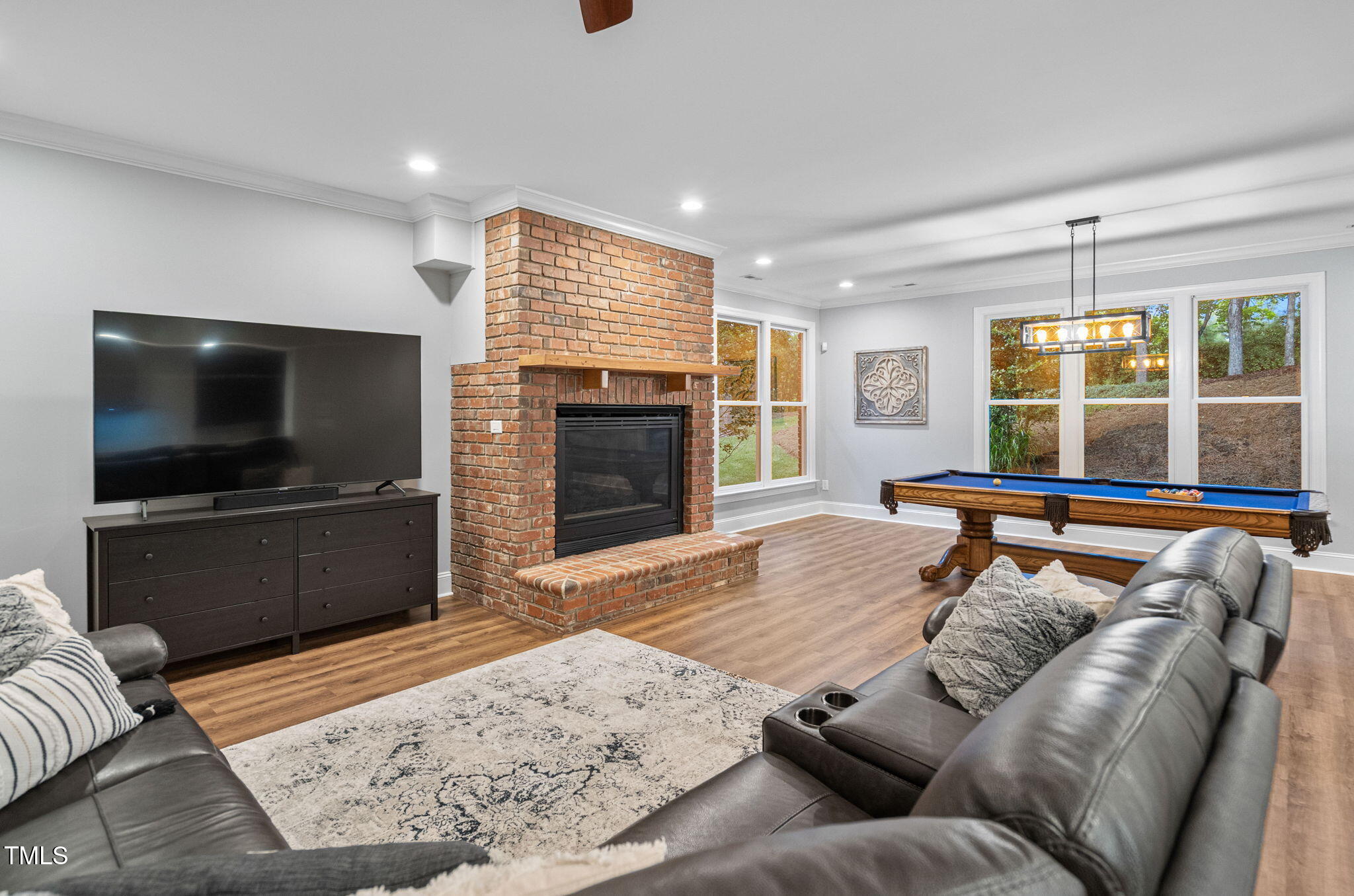 114 Kendleton Place Cary, NC 27518 - Photo 52 of 88 a living room with furniture and a flat screen tv