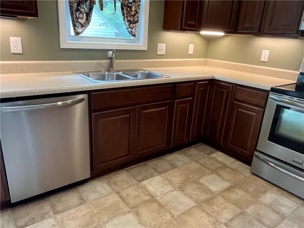 1429 Thyatira Brockton Road Jefferson, GA 30549 - Photo 12 of 46 a kitchen with a sink and cabinets