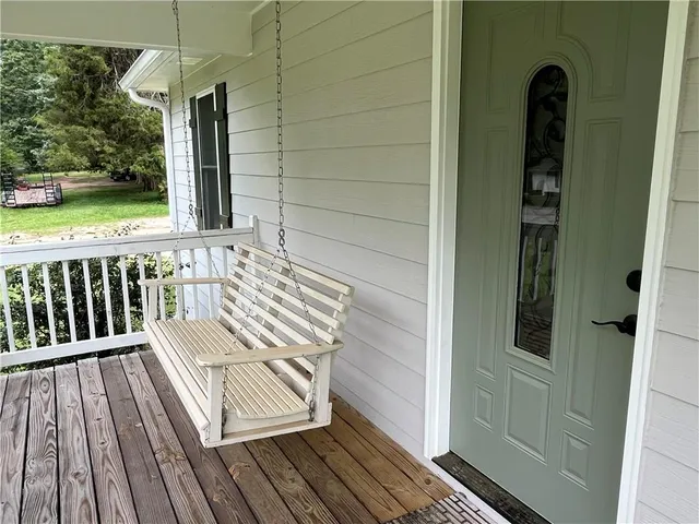 a view of a balcony with wooden floor