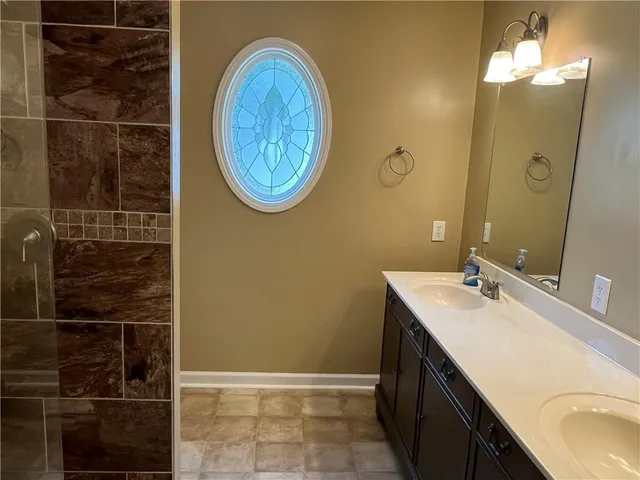 a bathroom with a sink and a mirror