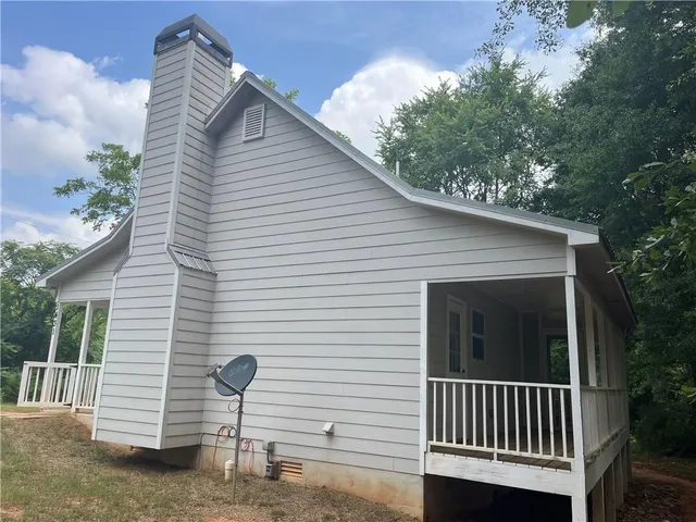 a front view of a house with a porch