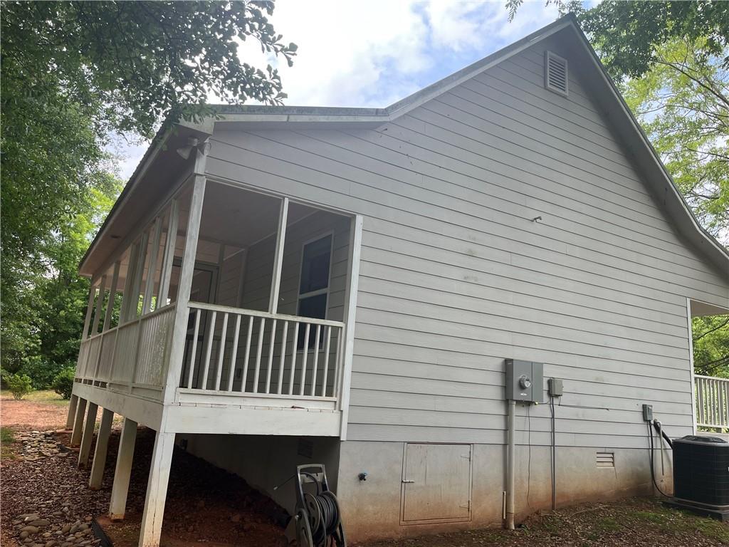 1429 Thyatira Brockton Road Jefferson, GA 30549 - Photo 35 of 46 a view of a house with a deck
