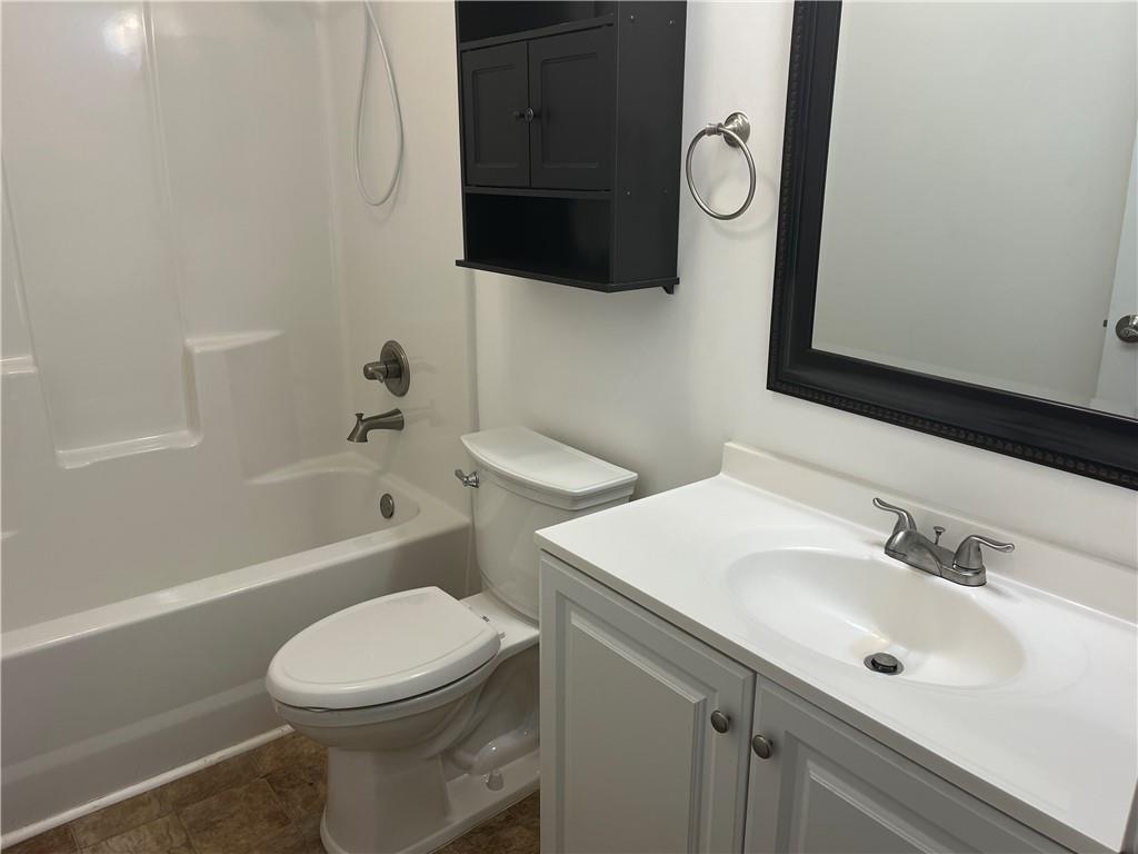 1429 Thyatira Brockton Road Jefferson, GA 30549 - Photo 42 of 46 a bathroom with a sink a toilet and shower