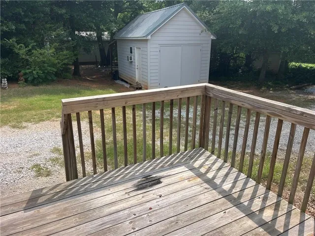 a view of balcony with wooden floor