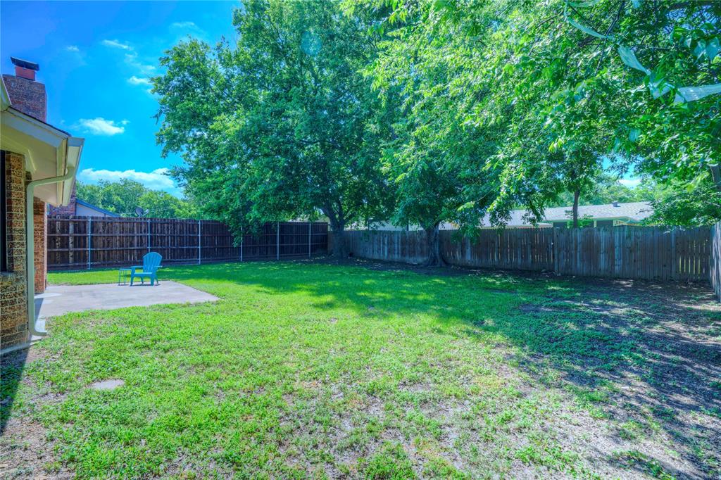 6028 Ridgecrest Drive Watauga, TX 76148 - Photo 35 of 40 a view of yard with green space and wooden fence