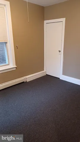 a bathroom with a toilet and a bathtub