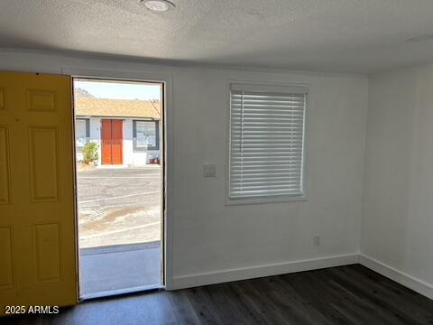 8910-8912 North 3rd Street Phoenix, AZ 85020 - Photo 12 of 37 a view of an empty room with wooden floor and a window