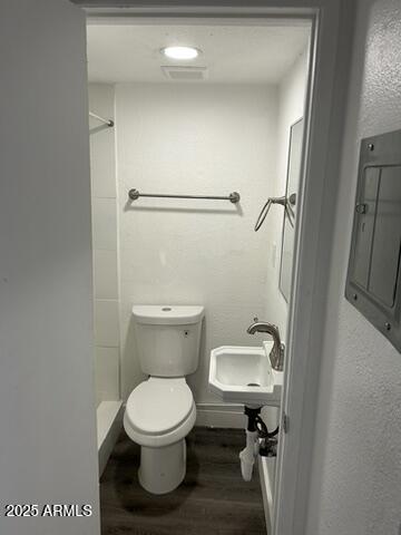 8910-8912 North 3rd Street Phoenix, AZ 85020 - Photo 25 of 37 a bathroom with a toilet and a sink
