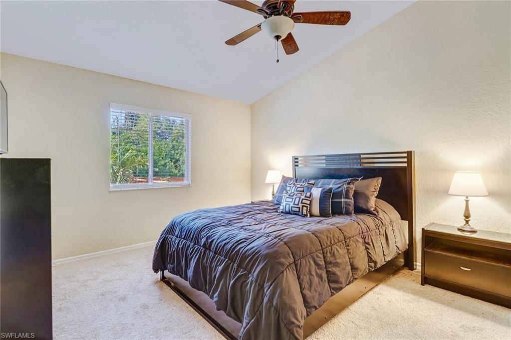 8426 Trillium Road Fort Myers, FL 33967 - Photo 5 of 18 a bedroom with a bed and window