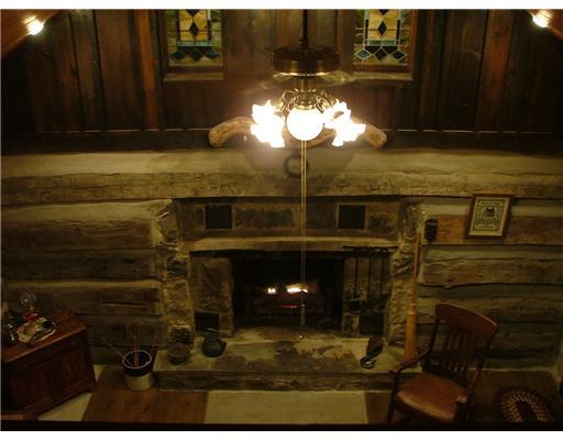 624 Scott Ridge Road Harmony, PA 16037 - Photo 14 of 18 Den/Family/Great Room. 200 year old cabin interior with functioning wood burning fireplace. Shown here with included gas burning logs.