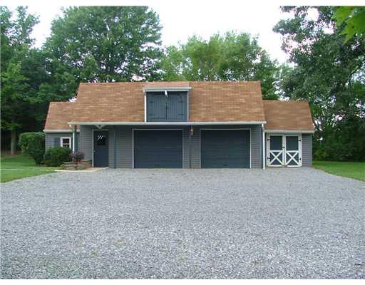 624 Scott Ridge Road Harmony, PA 16037 - Photo 4 of 18 Parking Lot/Garage. Dethatched 2 car garage. From left to right: wood shop with door entrance, first single car garage, second single care garage and finally the large lawn tool storage building. In addition, large second story loft for additional storage.