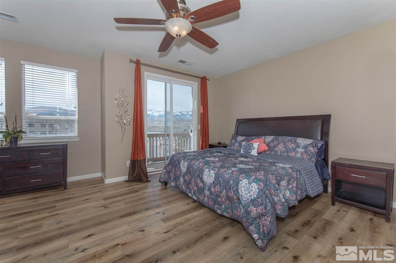 400 Parade Drive Reno, NV 89521 - Photo 11 of 24 a bedroom with a bed and a dresser