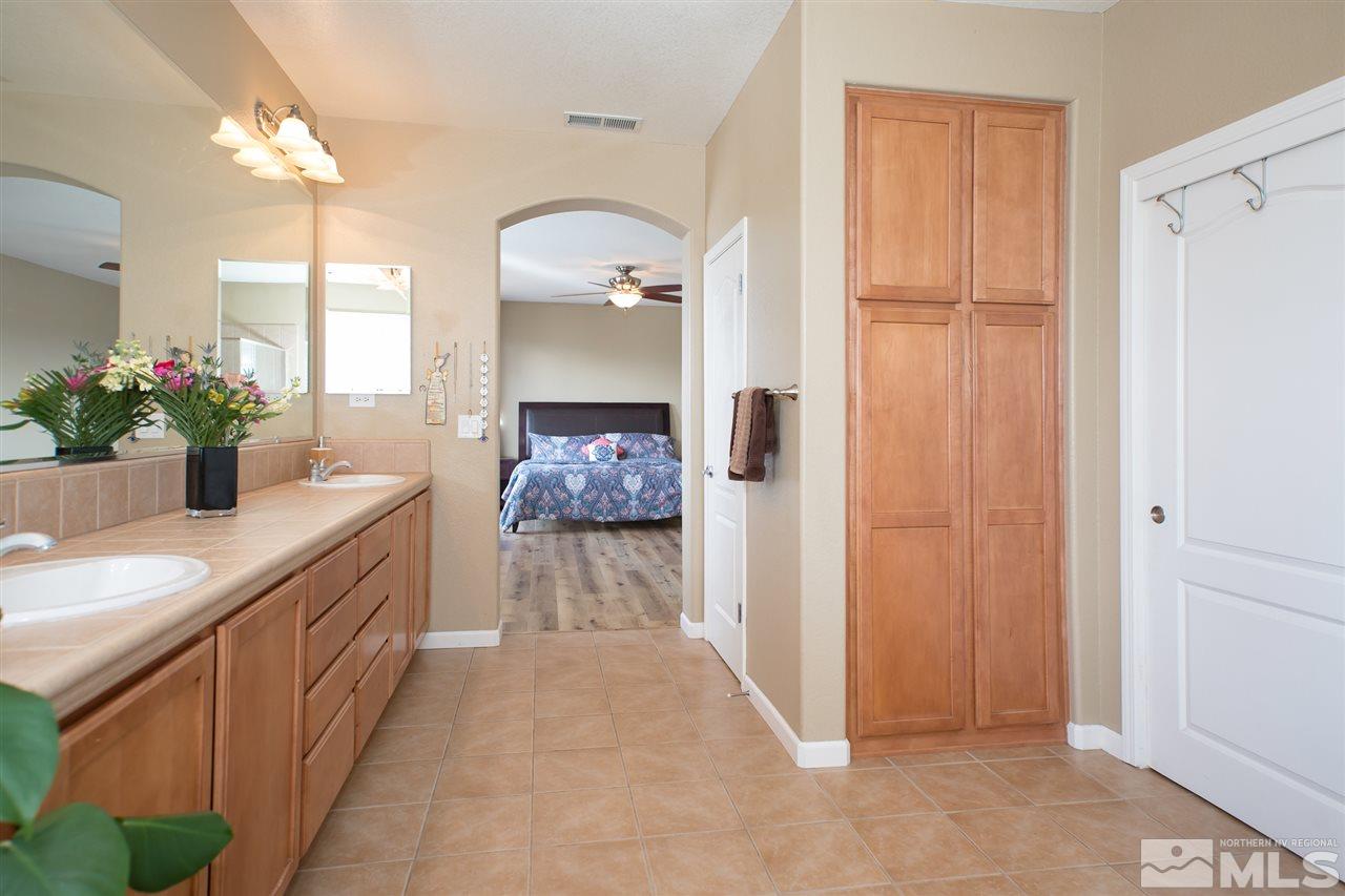 400 Parade Drive Reno, NV 89521 - Photo 13 of 24 a bathroom with a sink and a mirror