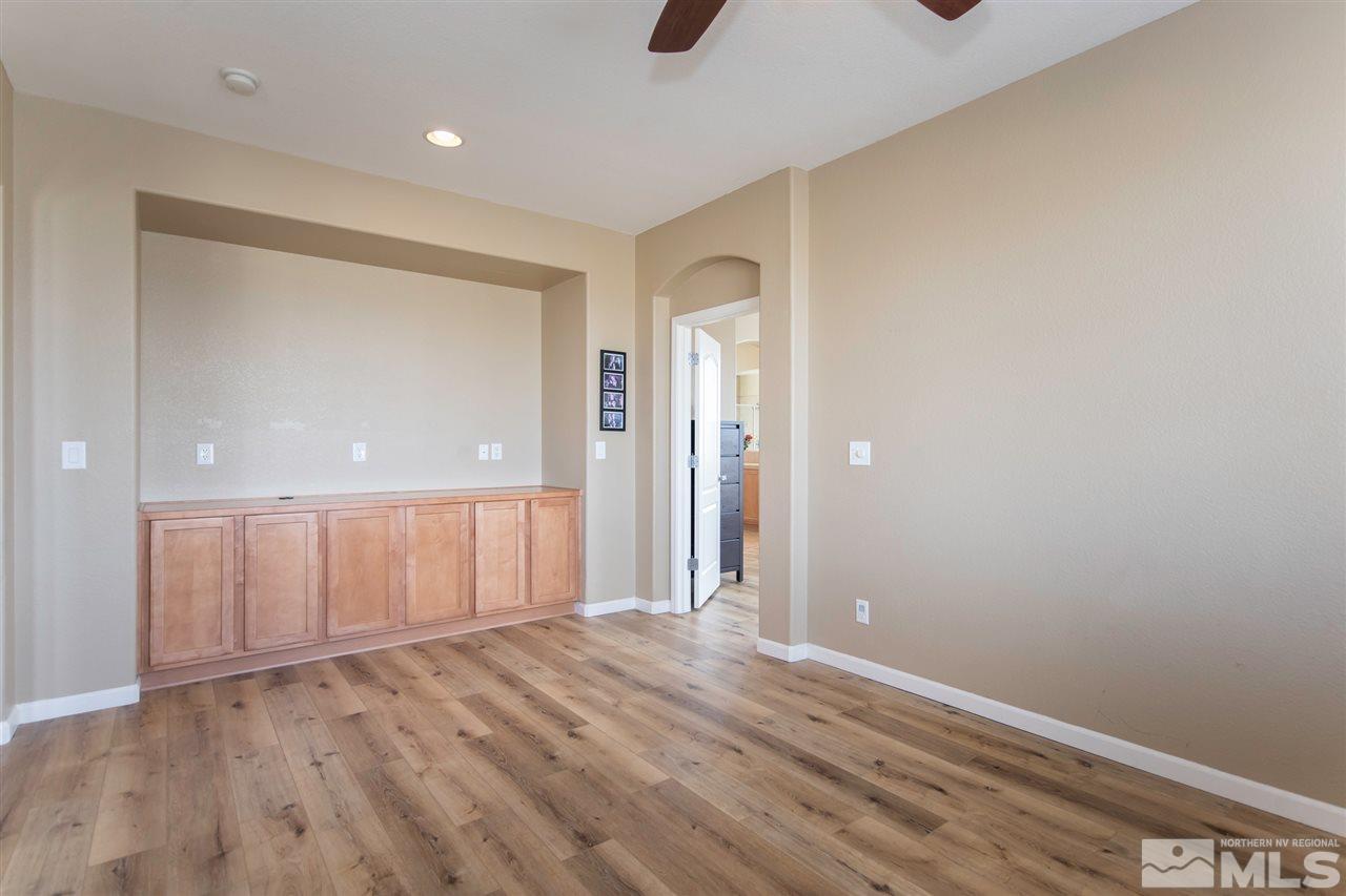 400 Parade Drive Reno, NV 89521 - Photo 15 of 24 wooden floor in an empty room with a window