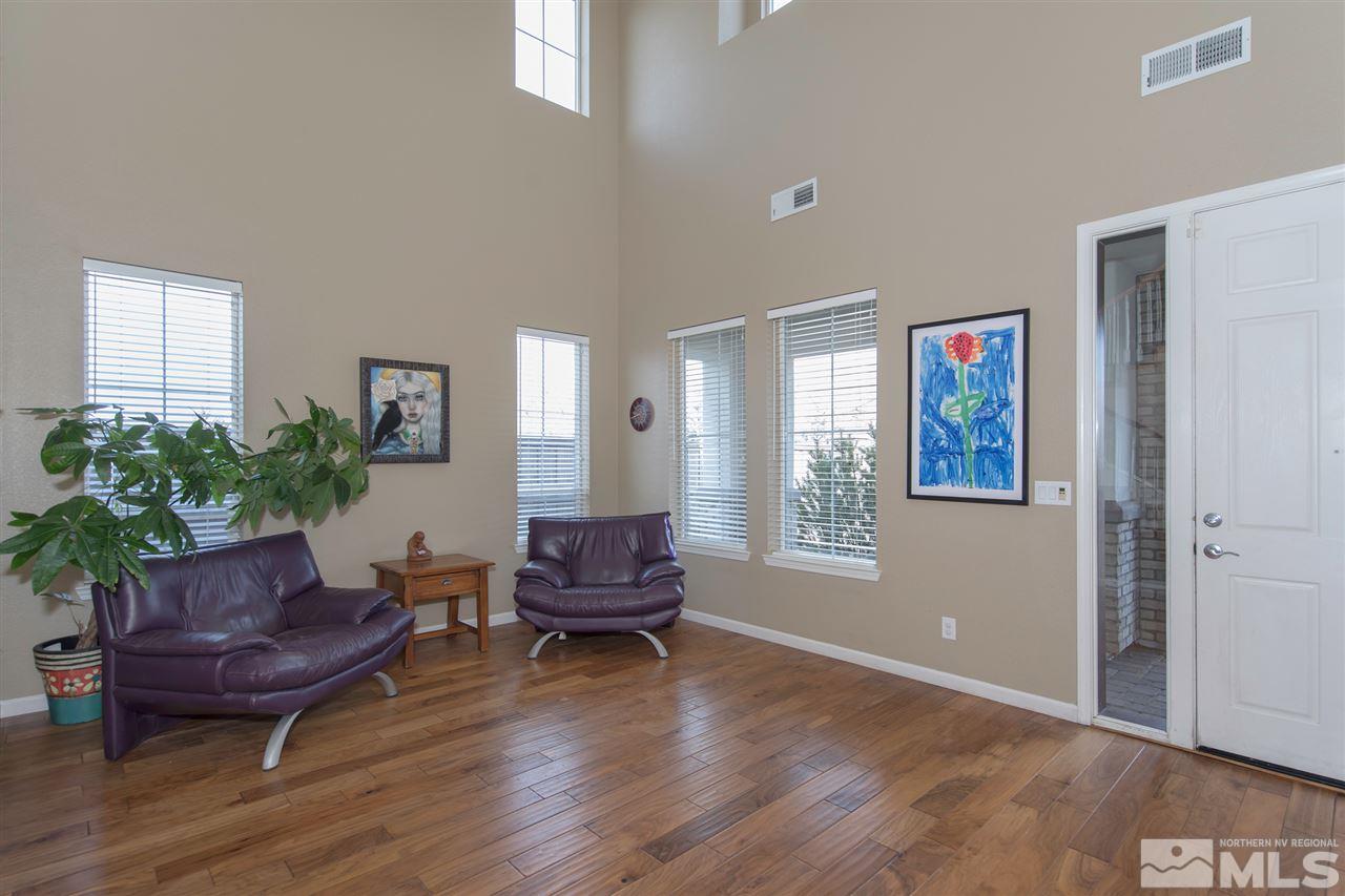 400 Parade Drive Reno, NV 89521 - Photo 2 of 24 a living room with furniture and a potted plant