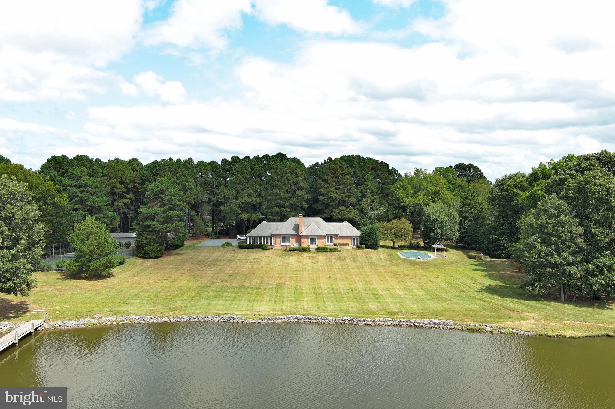 9338 Bantry Road Easton, MD 21601 - Photo 36 of 43 a view of a swimming pool with an ocean view
