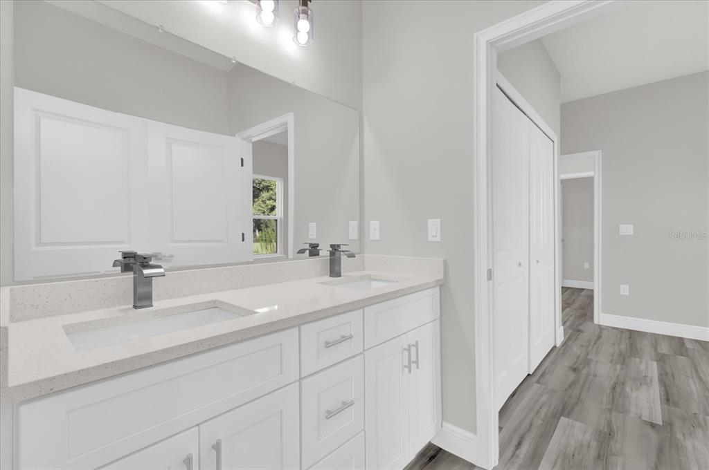 15684 Southwest 37th Circle Ocala, FL 34473 - Photo 18 of 34 a bathroom with a sink and a mirror