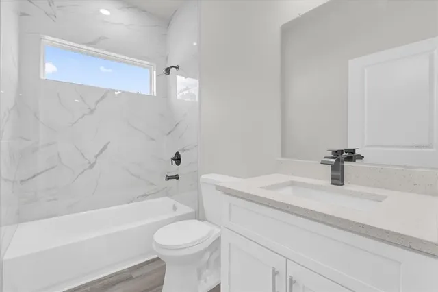 a bathroom with a sink a toilet and a bathtub