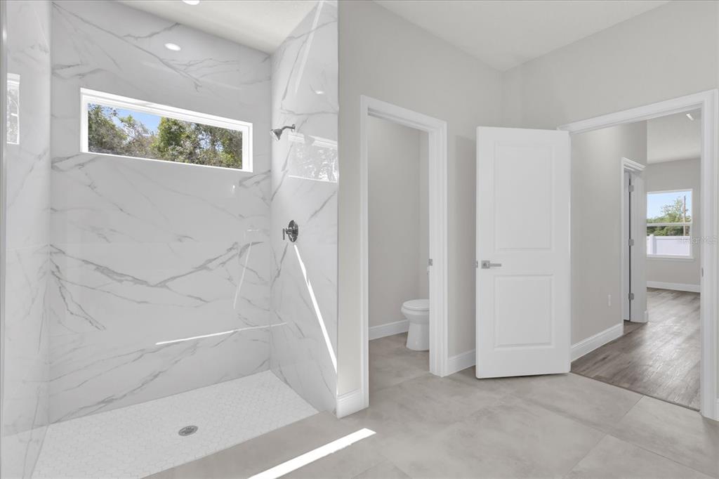 15684 Southwest 37th Circle Ocala, FL 34473 - Photo 29 of 34 a bathroom with a shower