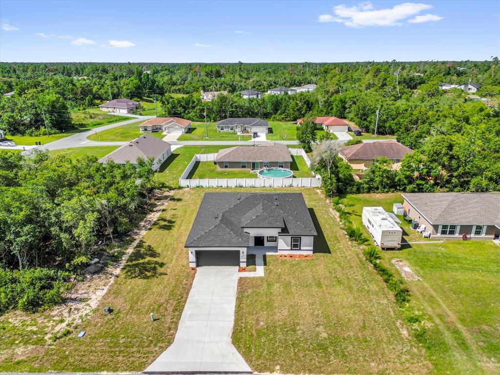 15684 Southwest 37th Circle Ocala, FL 34473 - Photo 30 of 34 an aerial view of a house with a garden