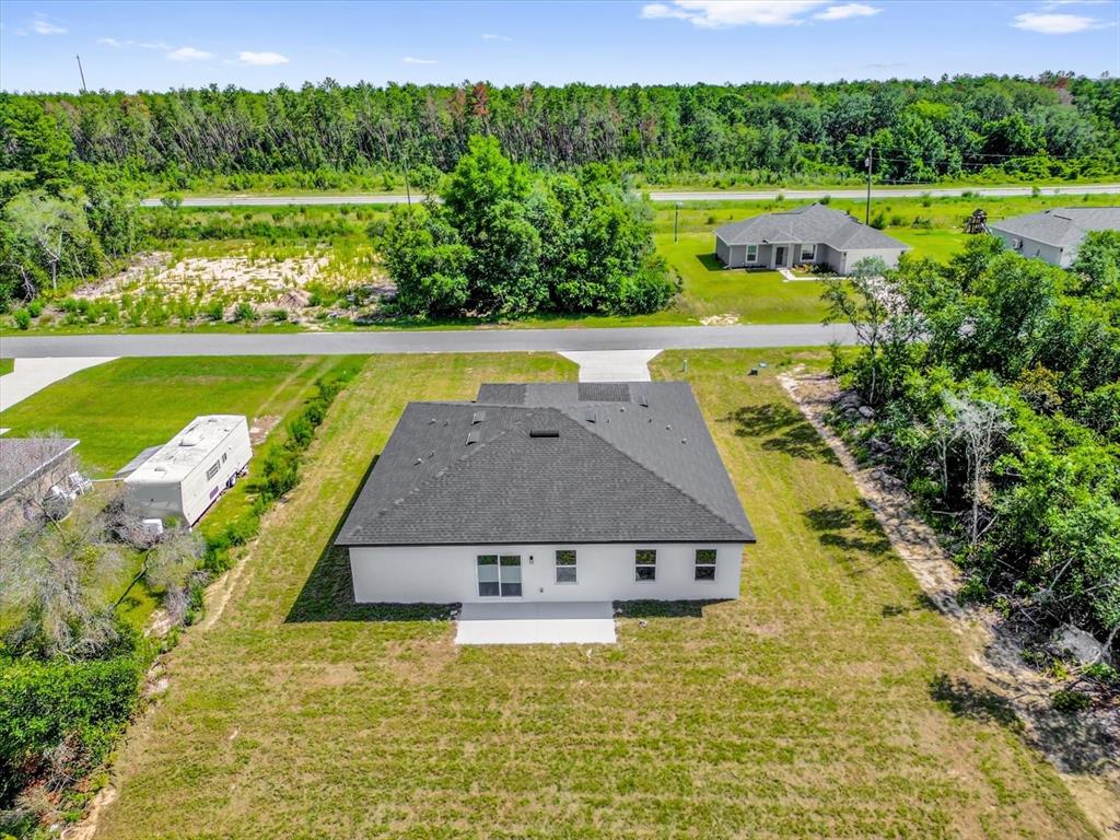 15684 Southwest 37th Circle Ocala, FL 34473 - Photo 33 of 34 a view of a house with a swimming pool