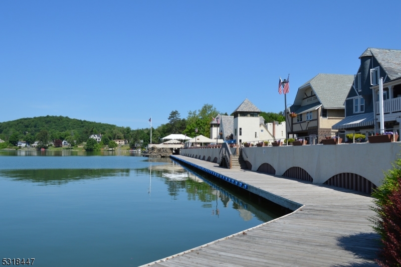 49 Ledgewood Trail Sparta, NJ 07871 - Photo 3 of 3 a view of swimming pool with outdoor seating and lake view