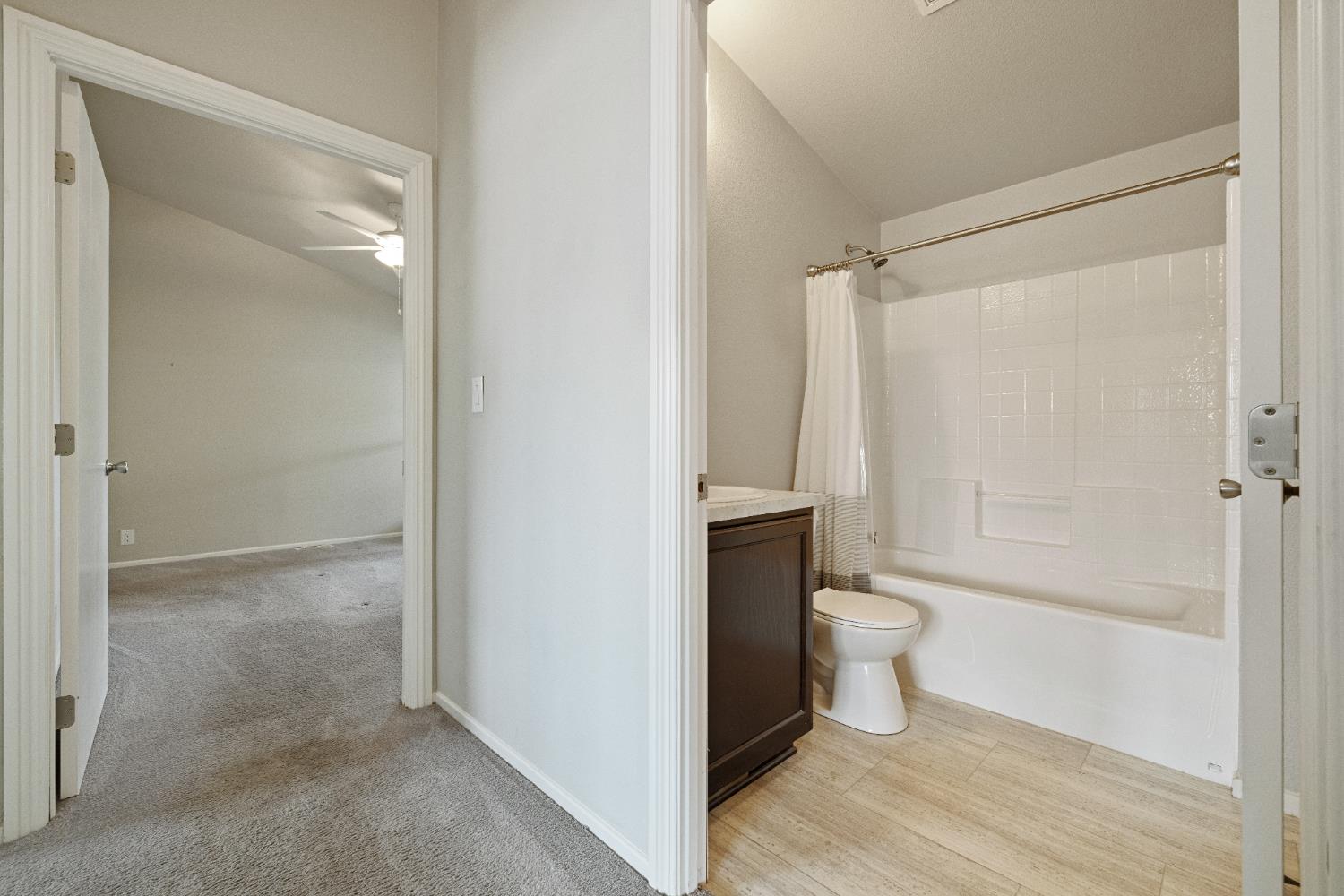 2621 Prescott, Unit 92 Modesto, CA 95350 - Photo 16 of 25 a bathroom with a toilet and a shower
