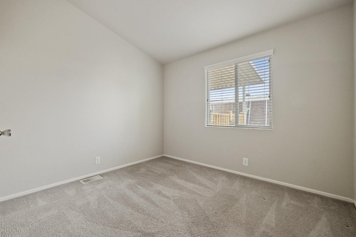 2621 Prescott, Unit 92 Modesto, CA 95350 - Photo 18 of 25 an empty room with a window