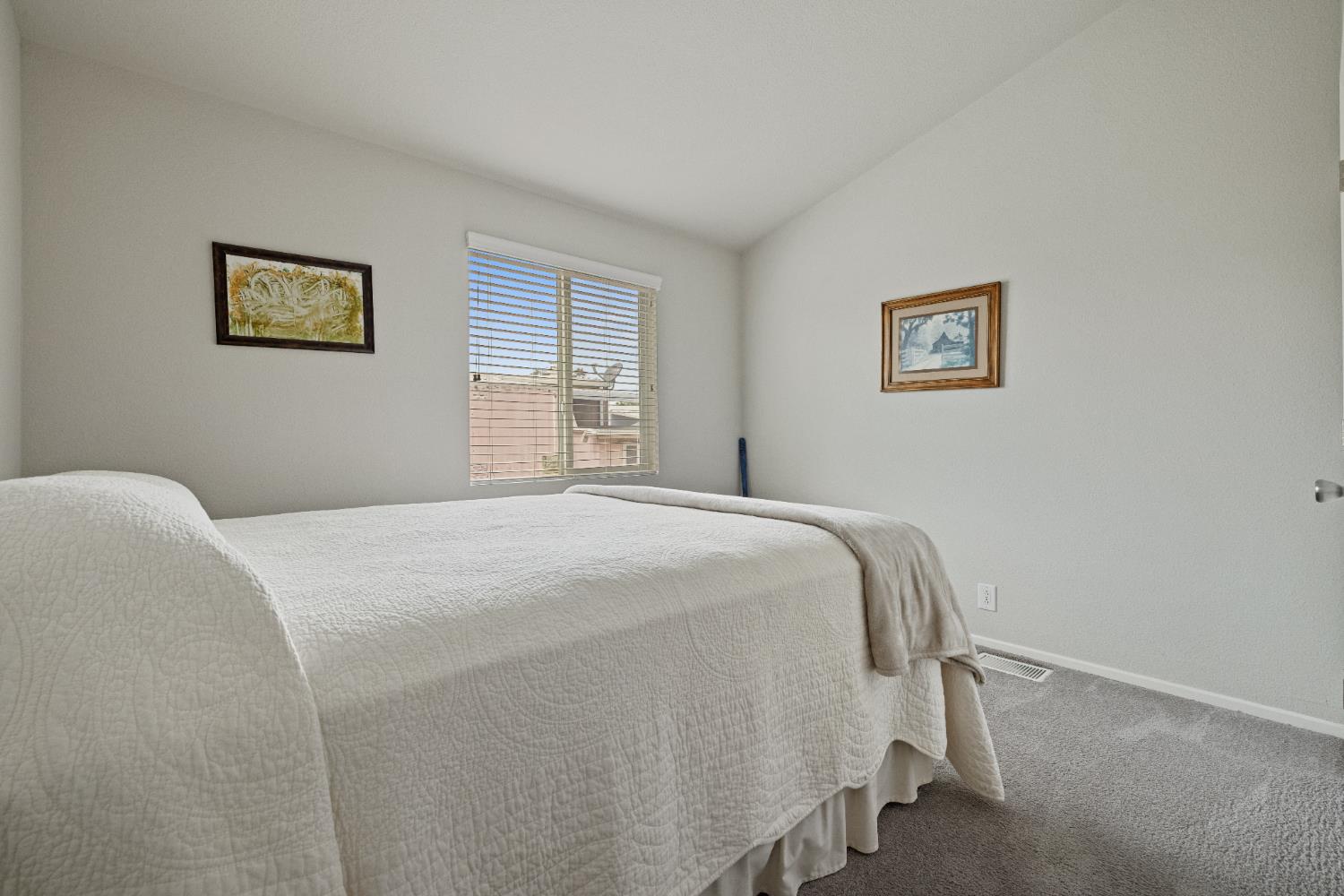 2621 Prescott, Unit 92 Modesto, CA 95350 - Photo 20 of 25 a bedroom with a bed and a window