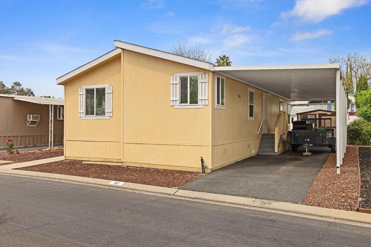 2621 Prescott, Unit 92 Modesto, CA 95350 - Photo 2 of 25 a view of a house with a garage